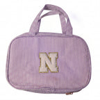 Travel toiletry bag placed on a white background