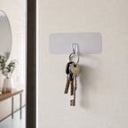 Keys hanging on transparent wall hook for organization