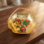 Golden kumkum kankavati used in religious ceremony