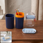 Tumbler, toothbrush holder, and soap dish in a modern bathroom accessories set