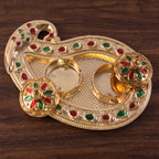Golden Tika box being used in a traditional ritual