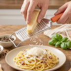 Kitchen use handheld grater in action