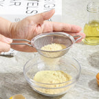 Tea strainer in use for kitchen straining