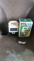 Camping lantern hanging inside a tent for indoor lighting