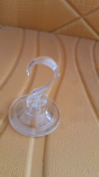 Close-up clear suction cup hook showing strong adhesion mechanism
