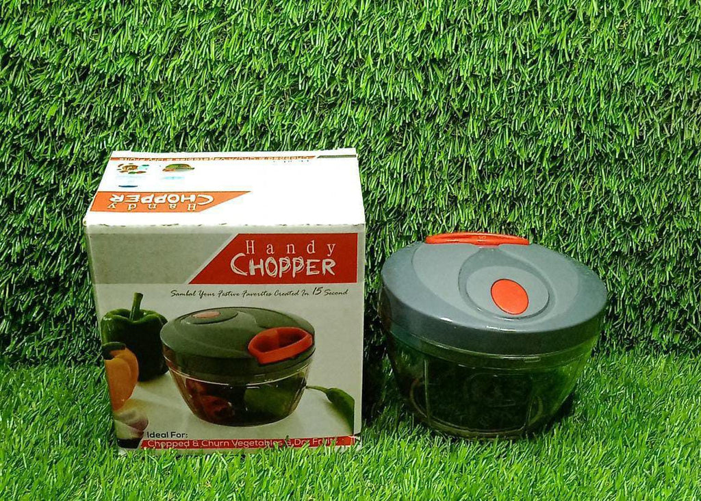 Lifestyle shot of the manual food chopper being used to prepare ingredients for a meal.