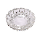 Versatile glass ashtray with multiple slots, suitable for both cigars and cigarettes.