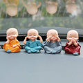 Adorable Baby Buddha showpiece set with four monk statues, perfect for home decor.