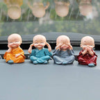 Adorable Baby Buddha showpiece set with four monk statues, perfect for home decor.