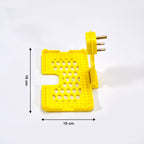 Detail of the three-pin design of the yellow mobile charging wall holder for secure fit.