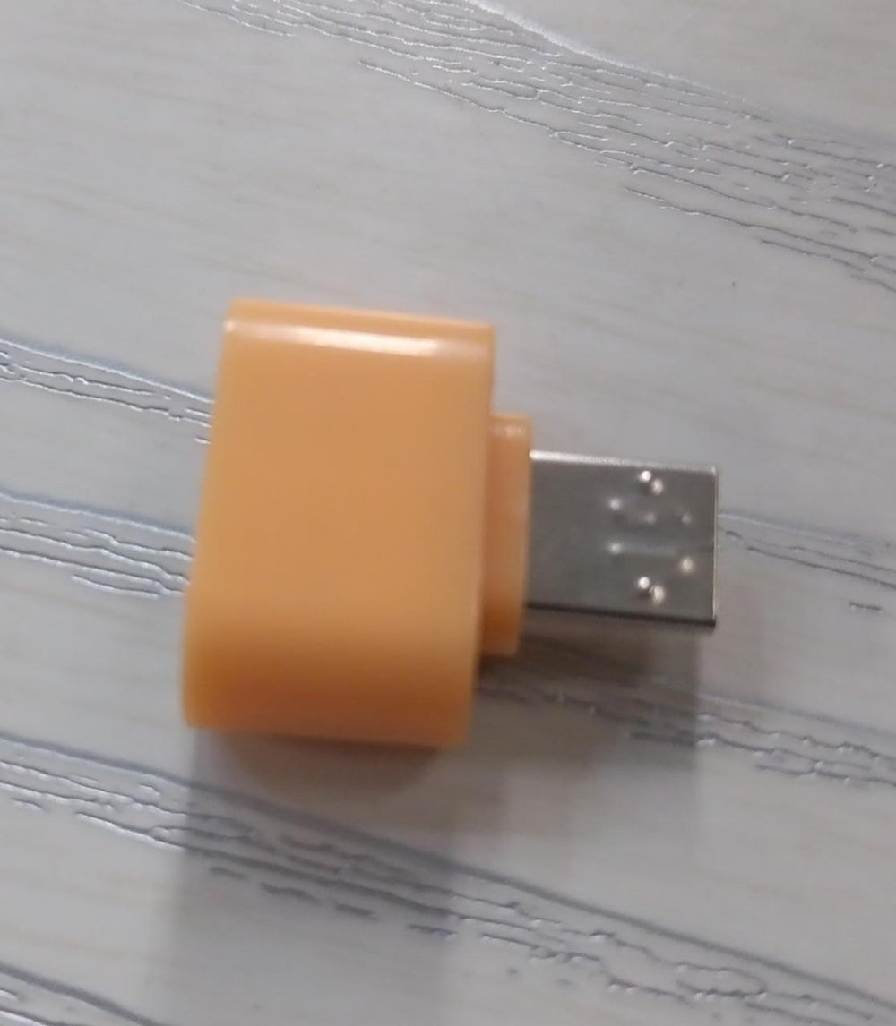 Detailed view of the Micro USB OTG adapter's connectors for reliable Android device pairing.
