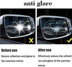 An example of the car mirror anti fog film being trimmed to fit a specific mirror shape.