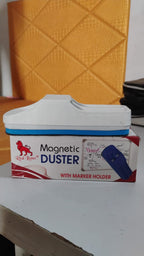 Magnetic board duster being used to clean a whiteboard in a school classroom.