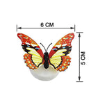 Butterfly 3D Illusion Night Lamp illuminated on bedside nightstand