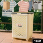 Foldable laundry basket with wheels placed in bedroom setting