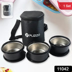 Stainless steel lunch box containers placed neatly inside insulated carry bag