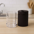 Salt and pepper shakers with textured ribbed grip for non-slip handling