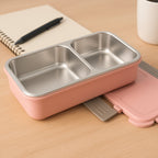 BPA-Free lunch box featuring built-in cutlery slot holding a spoon