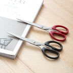 Top-down view of all-purpose stainless steel scissors with durable plastic handle.