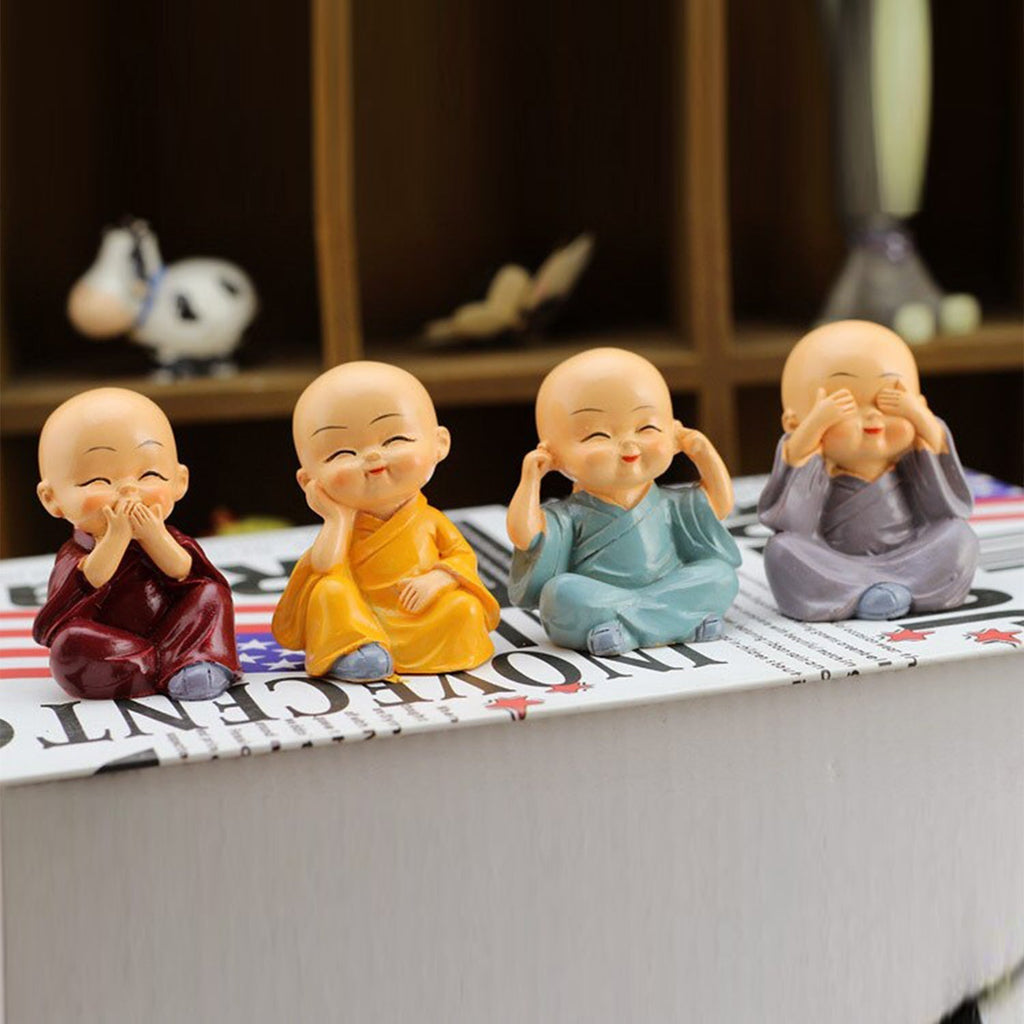 Four small Baby Buddha statues arranged elegantly, ideal for office or desk decoration.