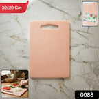 Kitchen chopping board in use with handle grip
