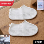 Pair of small white waterproof silicone rain shoe covers for outdoor use.