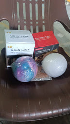 The 3D Moon Lamp Diffuser creating an enchanting ambiance with mist in a dim room
