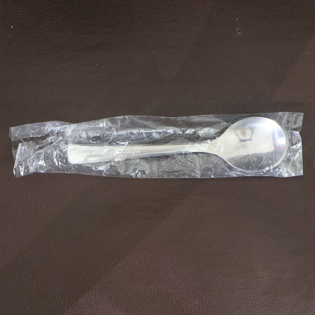 Dining spoons placed on kitchen table highlighting ergonomic design