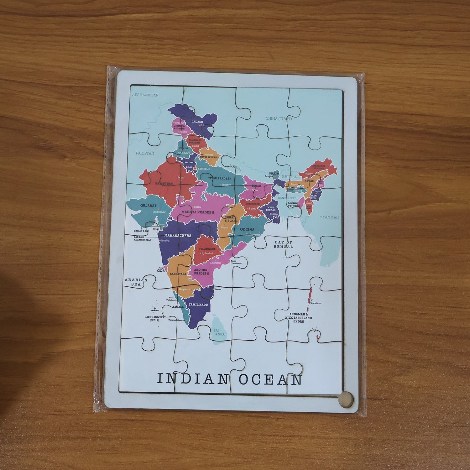 Top-down view of the completed wooden India map puzzle, ready for educational play.
