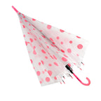 A partially closed white umbrella with pink polka dots and a pink curved handle is shown against a white background.