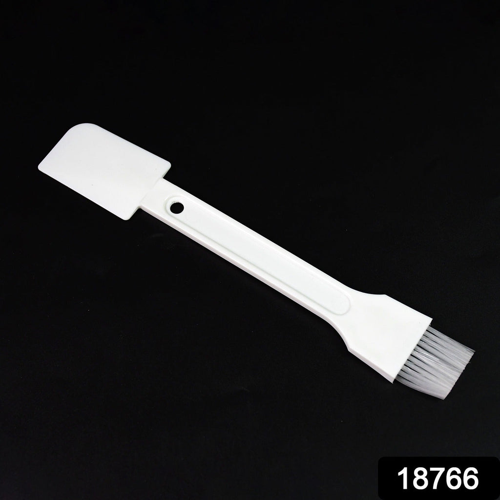Small dust cleaning brush effectively cleaning keyboard keys.
