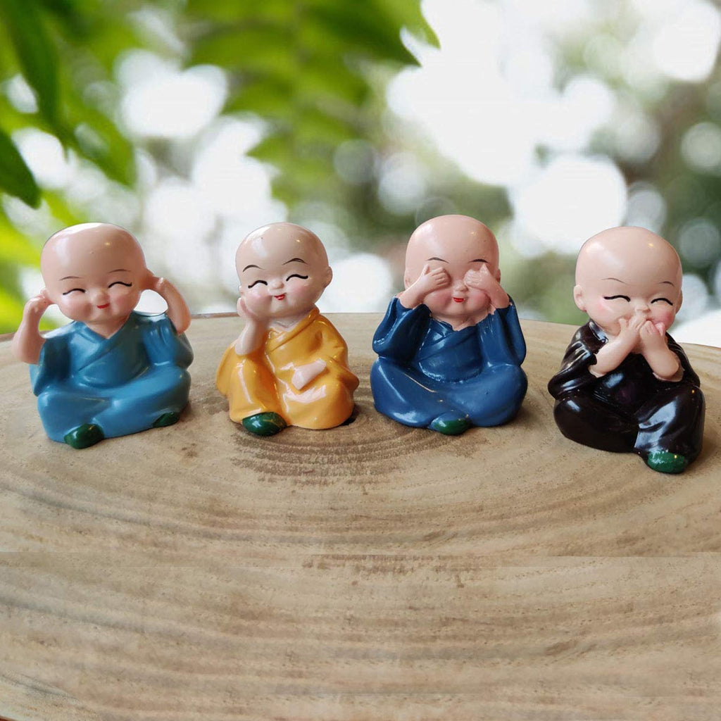 Side view of the charming Baby Buddha monk set, showcasing intricate details.