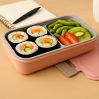 Open BPA-Free lunch box displaying two food compartments and cutlery slot