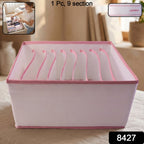 Clothes organizer storage compartments with clothing items