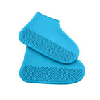 Two blue silicone rain boot covers with textured, non-slip soles are stacked on top of each other.