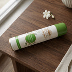 User spraying premium air freshener into indoor room for freshness