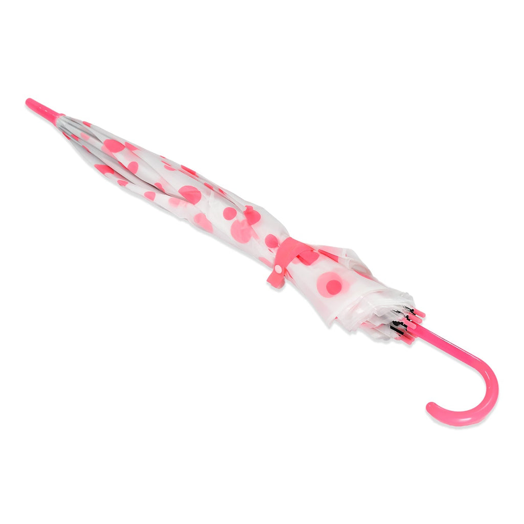 A neatly folded white umbrella with pink polka dots and a pink curved handle is secured with a pink strap.