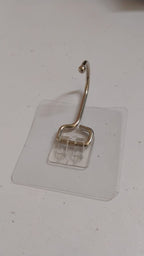 SteadyClear transparent adhesive wall hook holding towels and keys