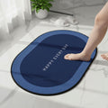 Non-slip oval bath mat with super absorbent velvet surface on bathroom floor