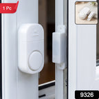 Wireless magnetic sensor alarm with adhesive mounting