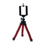 White mini tripod stand on a plain background for mobile use