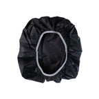 Compact rain cover shielding backpack during outdoor use
