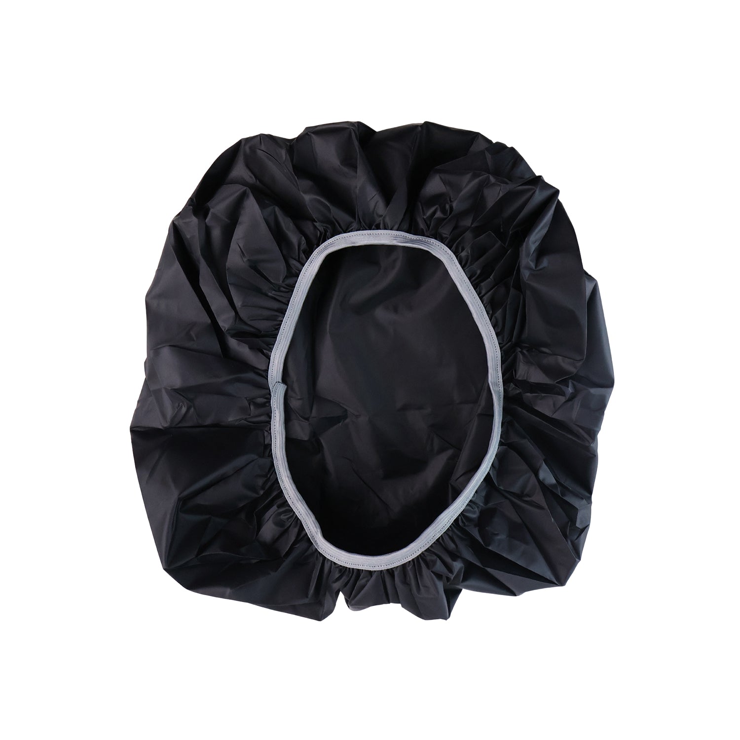 Compact rain cover shielding backpack during outdoor use