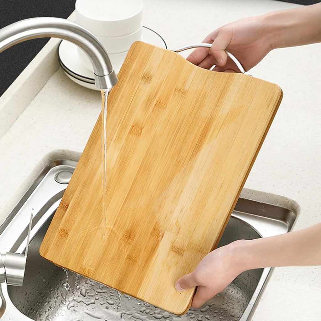 Wood chopping board with bamboo spoon, spatula and turner