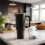 Black vacuum insulated tumbler on white background