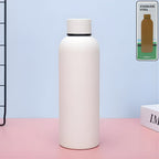 Insulated stainless steel water bottle in white color, 500ml capacity