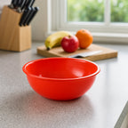 Stacked plastic red bowls showcasing lightweight design