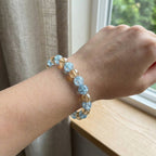 Angle view of stylish dual-tone beaded stretch bracelet