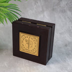 Top view of golden Charan Paduka with embossed metal art inside premium wooden case