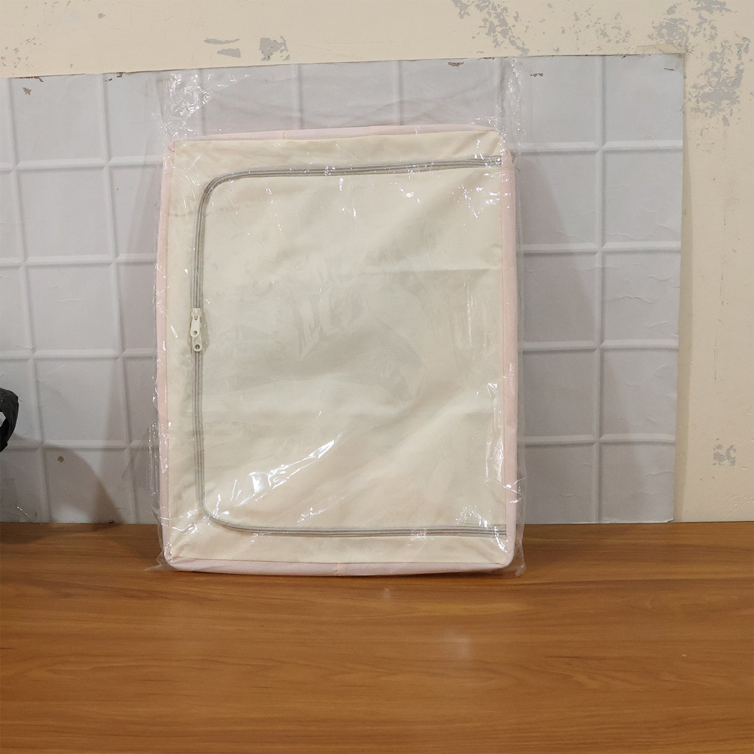 Comparison shot of foldable fabric storage boxes stacked on shelf